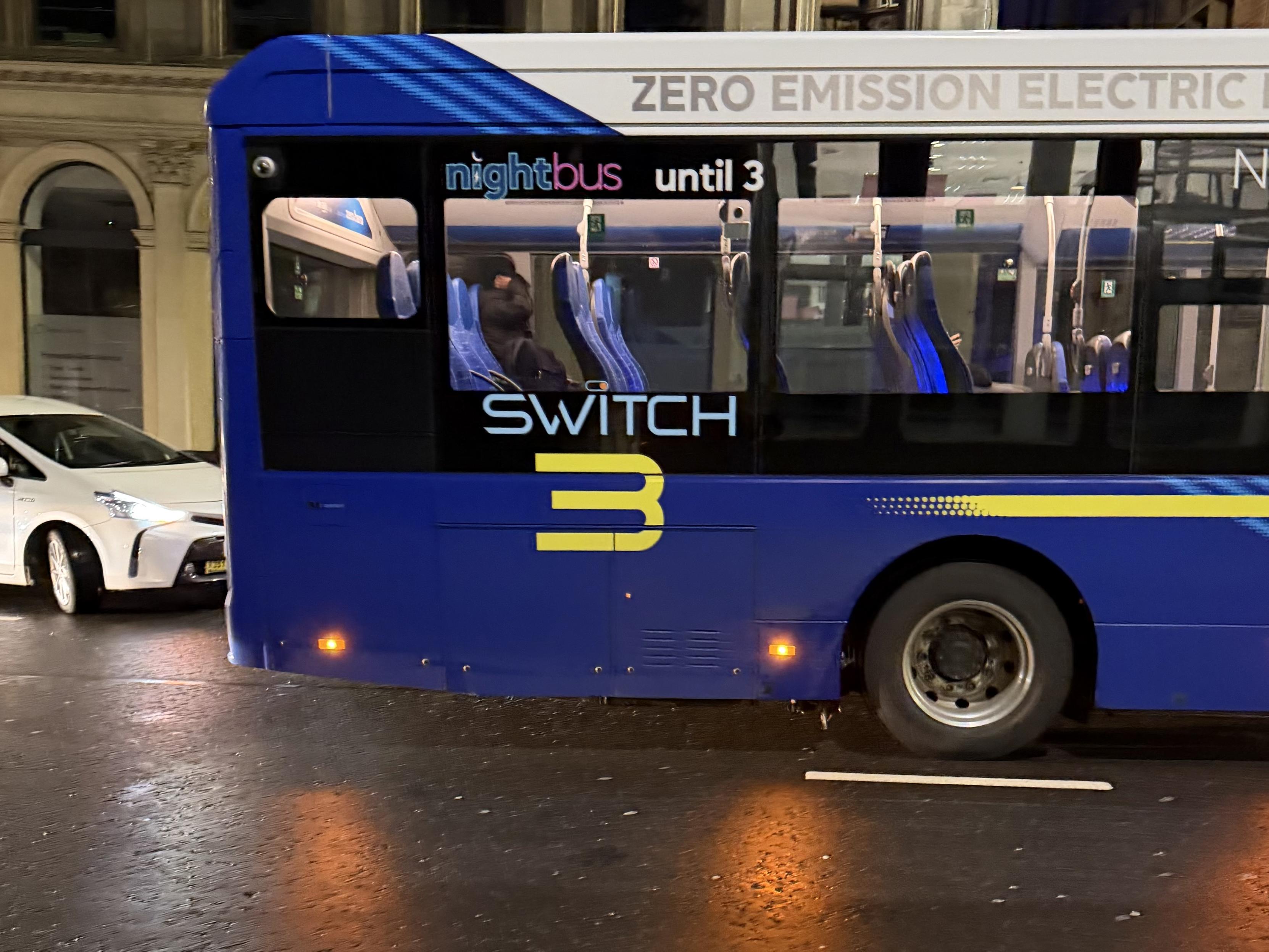 a bus that says “Switch 3” on the side in a gaudy style reminiscent of 2000s futuristic design